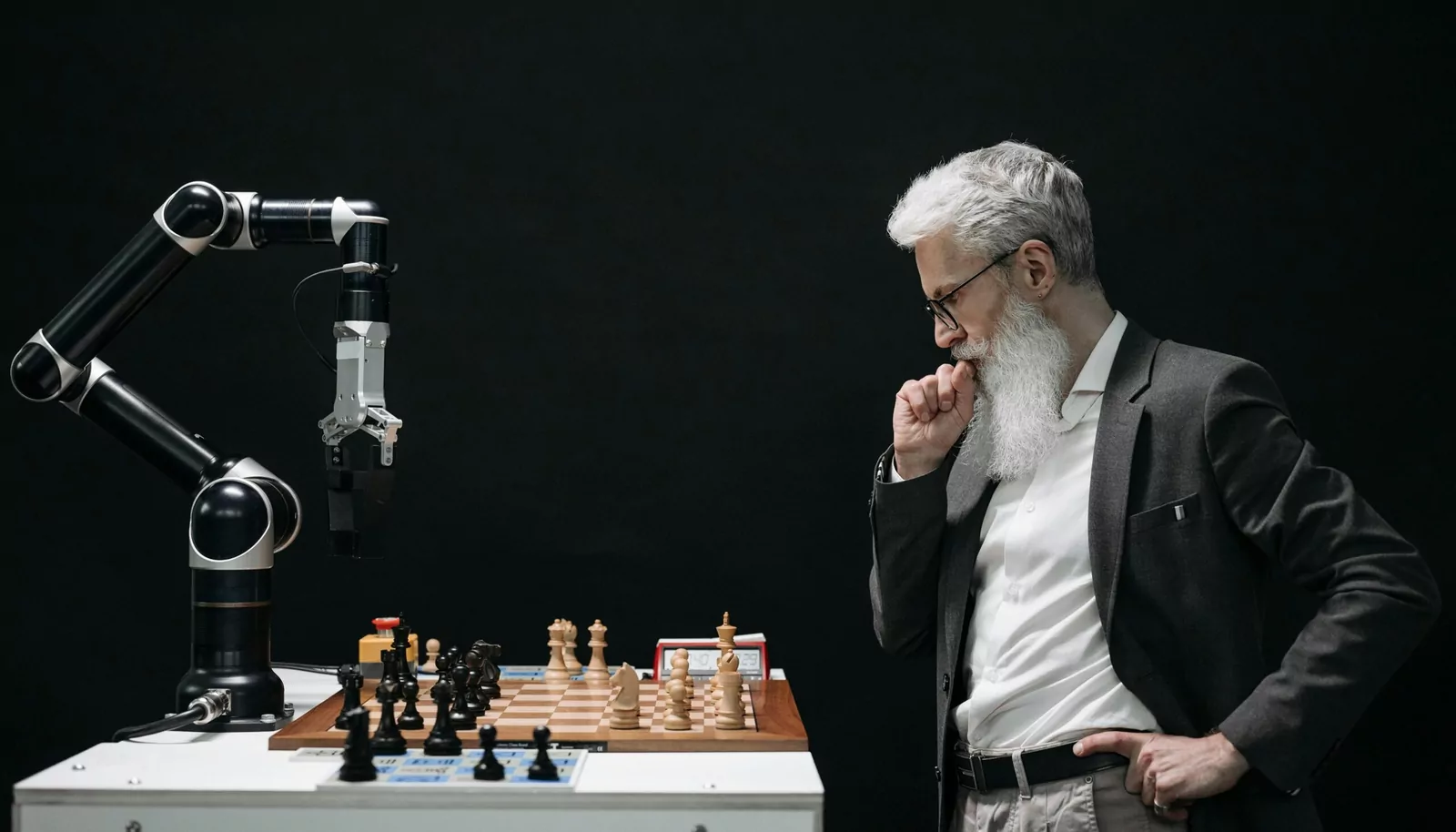 Man Thinking while Looking at a Chessboard